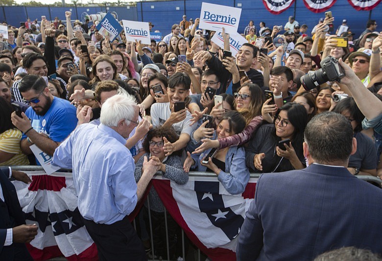 Democratic presidential candidate Sen. Bernie Sanders, I-Vt., greets supporters at a campaign event at Valley High School in Santa Ana, Calif., Friday, Feb. 21, 2020. (AP Photo/Damian Dovarganes)