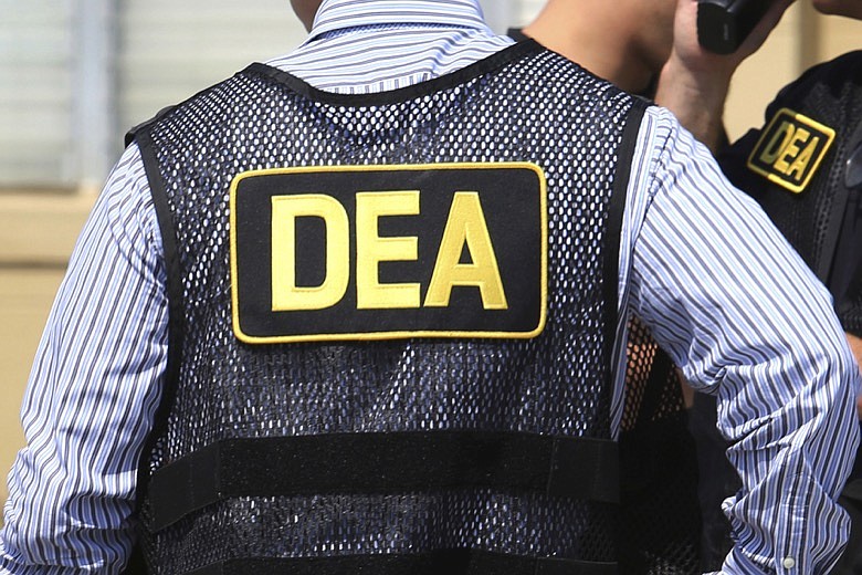 This June 13, 2016 file photo shows Drug Enforcement Administration (DEA) agents in Florida. On Friday, Feb. 21, 2020, the FBI arrested U.S. federal narcotics agent Jose Irizarry and his wife, Nathalia Gomez Irizarry, at their residence in Puerto Rico, according to a law enforcement official familiar with the arrest. He has been charged with conspiring to launder money with the very same Colombian drug cartels he was supposed to be fighting. (Joe Burbank/Orlando Sentinel via AP, File)