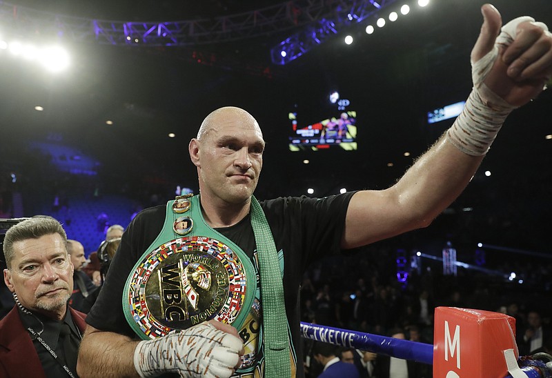 AP photo by Isaac Brekken / Tyson Fury celebrates after defeating Deontay Wilder in the WBC heavyweight championship boxing match Saturday night in Las Vegas.