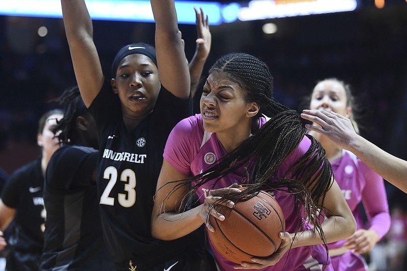 AP photo by Saul Young / Tennessee center Tamari Key grabs a rebound alongside Vanderbilt forward Koi Love on Sunday in Knoxville.