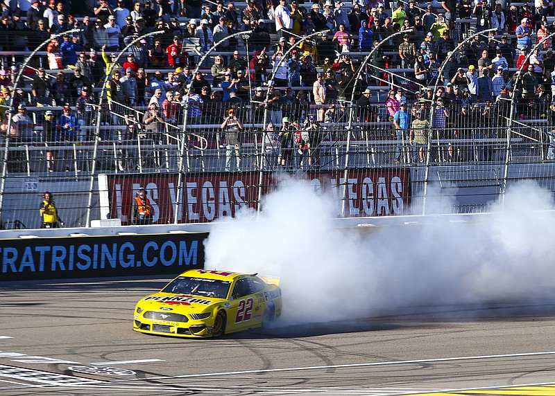 AP photo by Chase Stevens / Joey Logano burns down the tires in the Team Penske No. 22 Ford Mustang GT after hanging on to win Sunday's NASCAR Cup Series race at Las Vegas Motor Speedway.