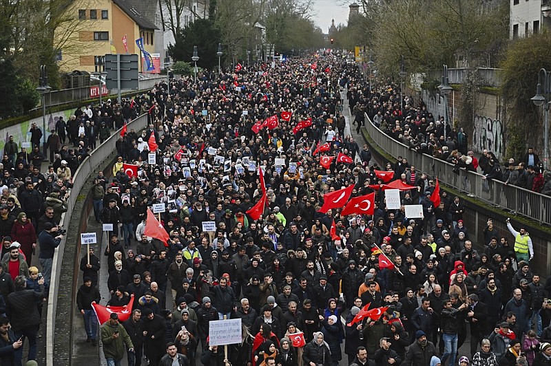 Thousands of people take part in a funeral march in Hanau, Germany, Sunday, Feb. 23, 2020. Several people were killed in a shooting in the central German city late Wednesday, Feb. 19, 2020. (Nicolas Armer/dpa via AP)