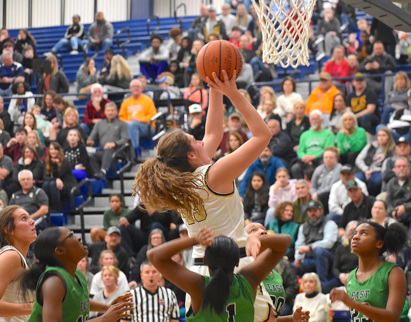 Bradley Central junior Anna Muhonen rises up above East Hamilton defenders in Monday's District 5-AAA championship game at Walker Valley High School. The Bearettes won their 10th straight district championship. / Staff photo by Patrick MacCoon