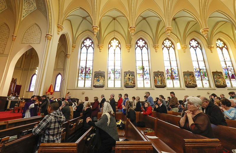 Staff file photo / Parishioners attend an Ash Wednesday mass at The Basilica of Sts. Peter & Paul in downtown Chattanooga on February 10, 2016.
