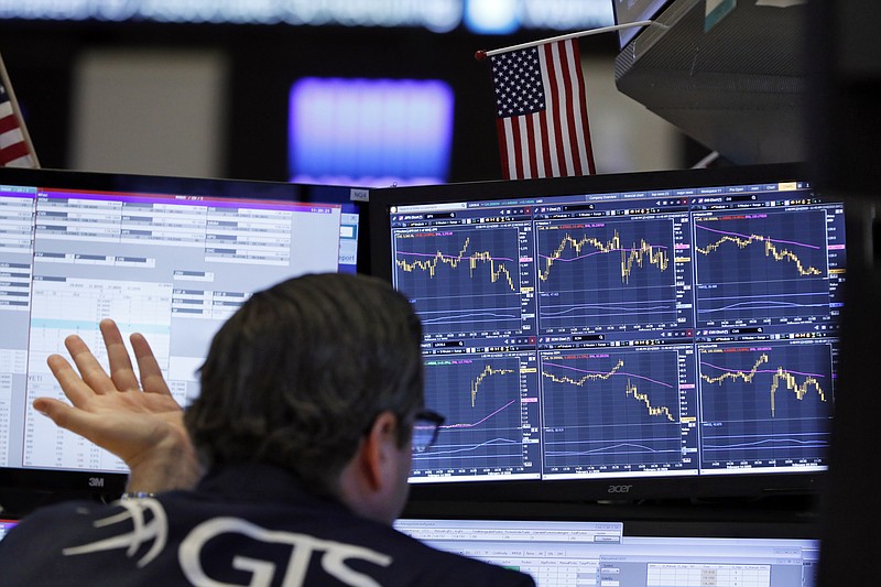 Specialist Gregg Maloney works at his post on the floor of the New York Stock Exchange, Tuesday, Feb. 18, 2020. U.S. stocks slipped in early trading Tuesday after technology giant Apple became the most well-known company to warn of a financial hit from the virus outbreak in China. (AP Photo/Richard Drew)