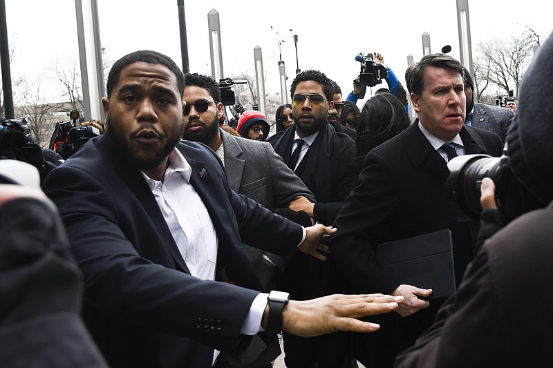 Former "Empire" actor Jussie Smollett arrives for an initial court appearance Monday, Feb. 24, 2020, at the Leighton Criminal Courthouse in Chicago, on a new set of charges alleging that he lied to police about being targeted in a racist and homophobic attack in downtown Chicago early last year. (AP Photo/Matt Marton)