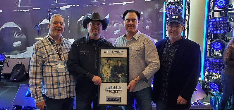 Photo by Cody McCarver / Chuck Rhodes and Bob Franks of Audium Records flank country music duo Scott and Todd Smith of Smith & Wesley, recent winners of the Music Row Independent Artist of the Year at the Country Radio Seminar.