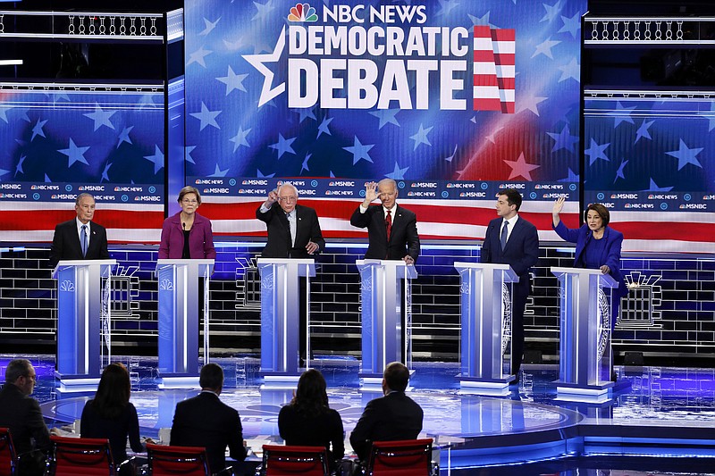 FILE - In this Feb. 19, 2020, file photo, from left, Democratic presidential candidates, former New York City Mayor Mike Bloomberg, Sen. Elizabeth Warren, D-Mass., Sen. Bernie Sanders, I-Vt., former Vice President Joe Biden, former South Bend Mayor Pete Buttigieg, Sen. Amy Klobuchar, D-Minn., participate in a Democratic presidential primary debate Wednesday, in Las Vegas, hosted by NBC News and MSNBC. The Democratic presidential contest has moved to immigrant-heavy Nevada, but the issues of immigration are seldom getting a thorough airing on the campaign trail. Candidates usually throw in a quick condemnation of President Donald Trump's hard-line policies but have shied away from outlining their own immigration positions. Immigration groups say that points to a potential vulnerability for whoever is the Democratic nominee later this year. (AP Photo/John Locher, File)