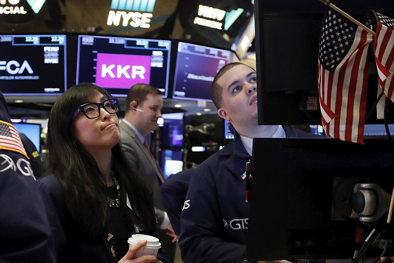 FILE - In this Feb. 24, 2020, file photo specialist Erica Fredrickson works with a colleague on the floor of the New York Stock Exchange. The U.S. stock market opens at 9:30 a.m. EST on Tuesday, Feb. 25. (AP Photo/Richard Drew, File)