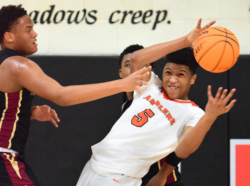 Staff Photo by Robin Rudd / LaFayette's DeCameron Porter (5) pulls down a rebound in traffic. The LaFayette Ramblers hosted the Cross Creek Razorbacks in the quarterfinals of the GHSA boys state basketball tournament on February 25, 2020.