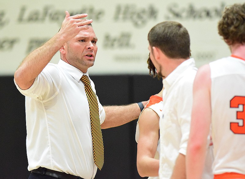 Staff Photo by Robin Rudd / LaFayette head coach Hank Peppers gathers the Ramblers around him.   The LaFayette Ramblers hosted the Cross Creek Razorbacks in the quarterfinals of the GHSA boys state basketball tournament on February 25, 2020. 