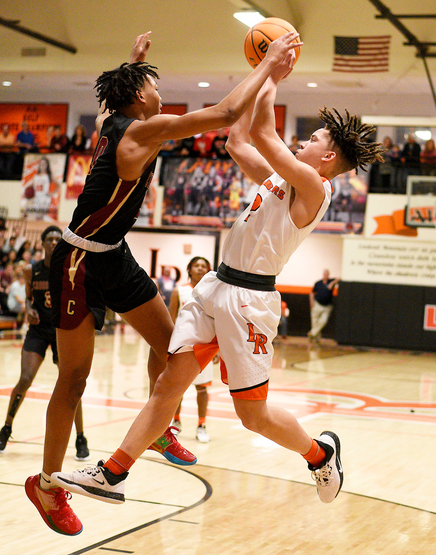 Staff Photo by Robin Rudd / LaFayette's Junior Barber (2) sinks a off-balance jump shot. The LaFayette Ramblers hosted the Cross Creek Razorbacks in the quarterfinals of the GHSA boys state basketball tournament on February 25, 2020.