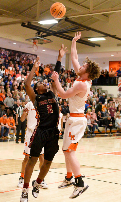 Staff Photo by Robin Rudd / LaFayette's Asa Deal (34) hits a turnaround over Cross Creek's Dajaun Rouse (2). The LaFayette Ramblers hosted the Cross Creek Razorbacks in the quarterfinals of the GHSA boys state basketball tournament on February 25, 2020.