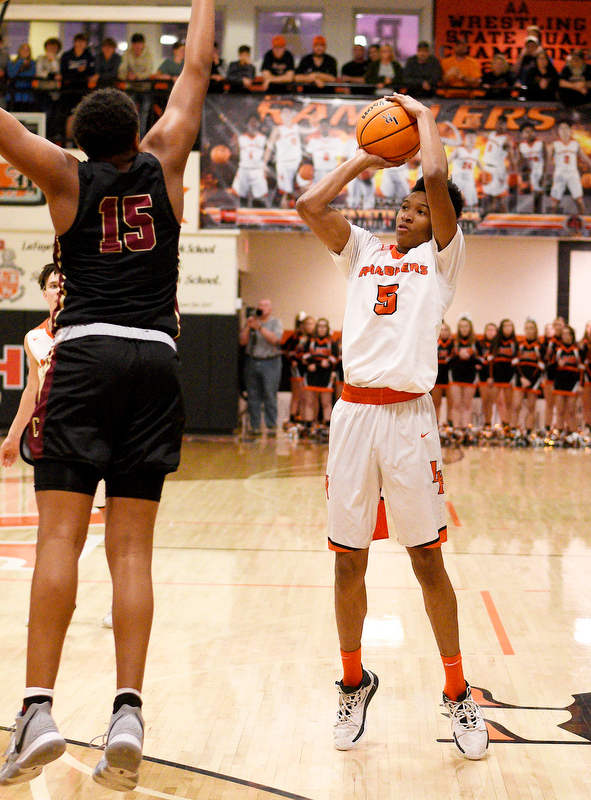 Staff Photo by Robin Rudd / LaFayette's DeCameron Porter (5) sinks a three pointer over Cross Creek's Corey Trotter (15). The LaFayette Ramblers hosted the Cross Creek Razorbacks in the quarterfinals of the GHSA boys state basketball tournament on February 25, 2020.