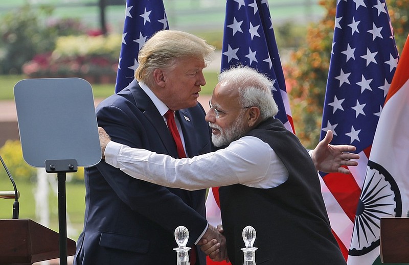 U.S. President Donald Trump and Indian Prime Minister Narendra Modi embrace after giving a joint statement in New Delhi, India, Tuesday, Feb. 25, 2020. (AP Photo/Manish Swarup)