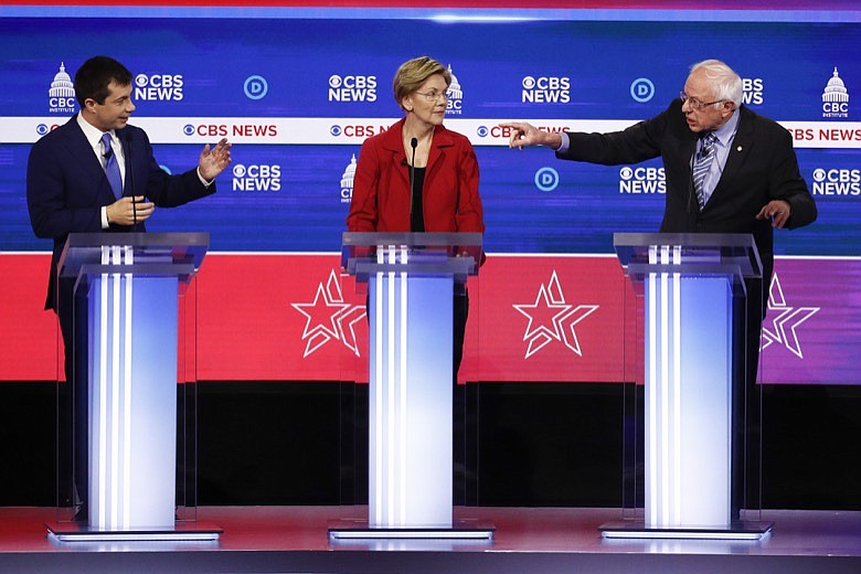 From left, Democratic presidential candidates, former South Bend Mayor Pete Buttigieg, Sen. Elizabeth Warren, D-Mass., and Sen. Bernie Sanders, I-Vt., participate in a Democratic presidential primary debate at the Gaillard Center, Tuesday, Feb. 25, 2020, in Charleston, S.C., co-hosted by CBS News and the Congressional Black Caucus Institute. (AP Photo/Patrick Semansky)