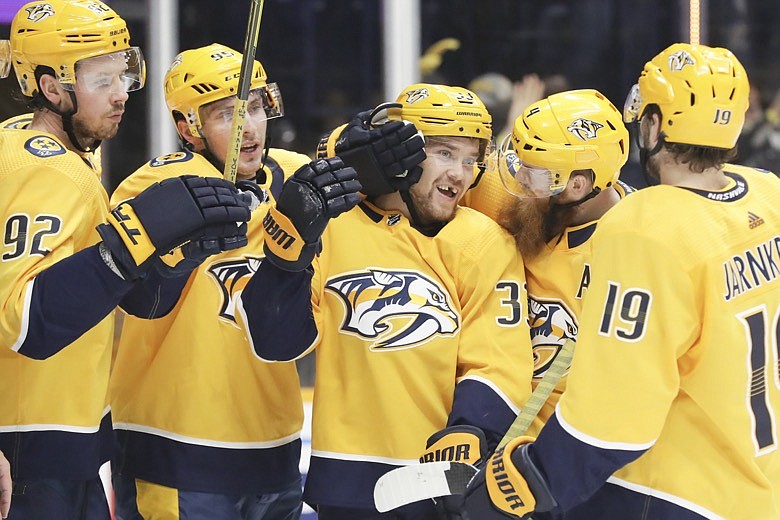 Nashville Predators right wing Viktor Arvidsson (33), of Sweden, is congratulated after scoring a goal against the Ottawa Senators in the second period of an NHL hockey game Tuesday, Feb. 25, 2020, in Nashville, Tenn. (AP Photo/Mark Humphrey)