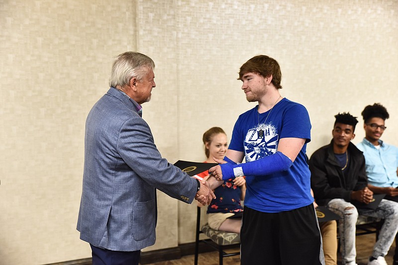 Contributed photo / Classroom instructor Peter Yakimowich presents Noah McDevitt with his certification of completion from the Skill Up program in May 2019.