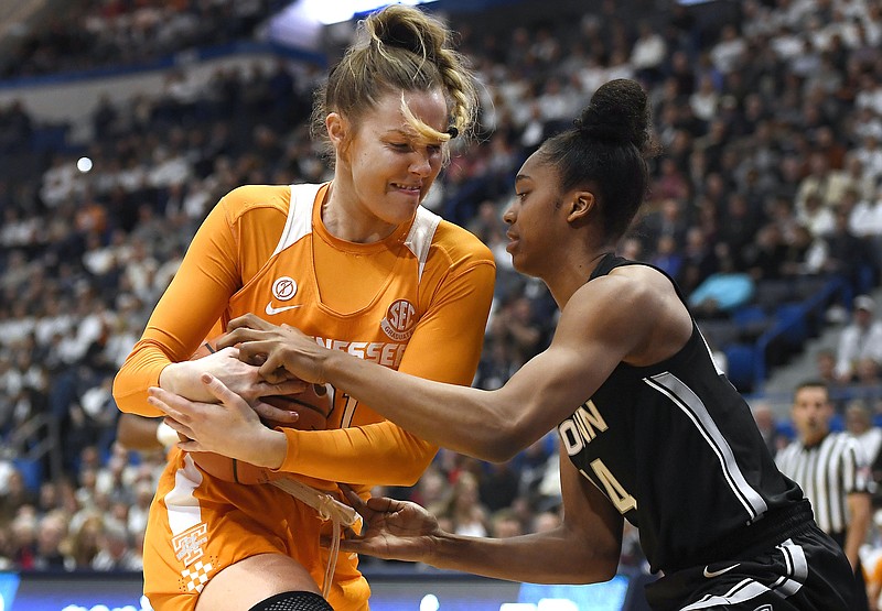 AP photo by Jessica Hill / Tennessee's Lou Brown, left, and Connecticut's Aubrey Griffin fight for the basketball during the first half on Jan. 23 in Hartford, Conn.