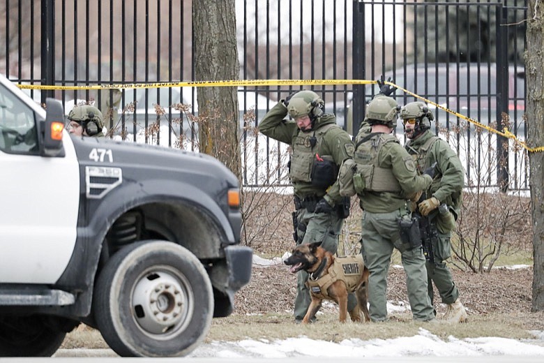 Police work outside the Molson Coors Brewing Co. campus in Milwaukee on Wednesday, Feb. 26, 2020, after reports of a possible shooting. (AP Photo/Morry Gash)