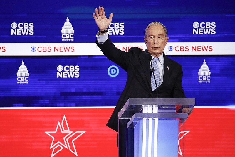 Democratic presidential candidates, former New York City Mayor Mike Bloomberg, raises his hand during the Democratic presidential primary debate at the Gaillard Center, Tuesday, Feb. 25, 2020, in Charleston, S.C., co-hosted by CBS News and the Congressional Black Caucus Institute. (AP Photo/Patrick Semansky)