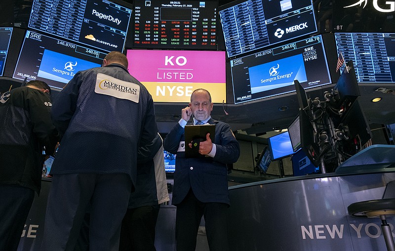 Traders work on the floor of the New York Stock Exchange Thursday, Feb. 27, 2020. (AP Photo/Craig Ruttle)