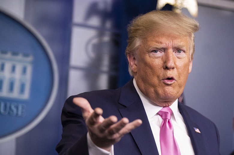 President Donald Trump with members of the president's coronavirus task force speaks during a news conference at the Brady press briefing room of the White House, Wednesday, Feb. 26, 2020, in Washington. (AP Photo/Manuel Balce Ceneta)