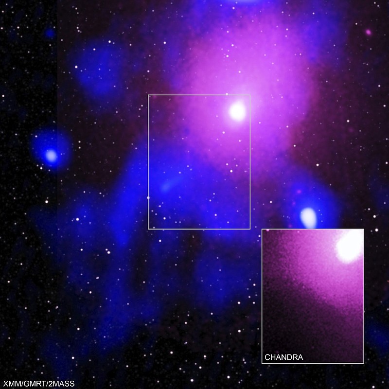 This image made available by NASA on Thursday, Feb. 27, 2020 shows the Ophiuchus galaxy cluster viewed in a composite of X-ray, radio and infrared data. The inset image at bottom right shows data from the Chandra X-ray Observatory which confirmed a cavity formed by a record-breaking explosion from a super-massive black hole. The explosion was so large it carved out a crater in the hot gas that could hold 15 Milky Ways, said lead author Simona Giacintucci of the Naval Research Laboratory in Washington. (Chandra: NASA/CXC/NRL/S. Giacintucci, et al., XMM: ESA/XMM; Radio: NCRA/TIFR/GMRT; Infrared: 2MASS/UMass/IPAC-Caltech/NASA/NSF via AP)


