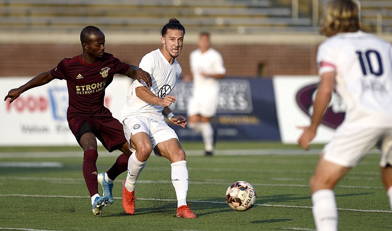 Staff file photo by Robin Rudd / Cameron Woodfin, second from left, and Juan Hernandez (10) are two of nine players who return for Chattanooga FC's first professional season. CFC opens NISA action Saturday night at 8:10 EST in California against Oakland Roots SC.