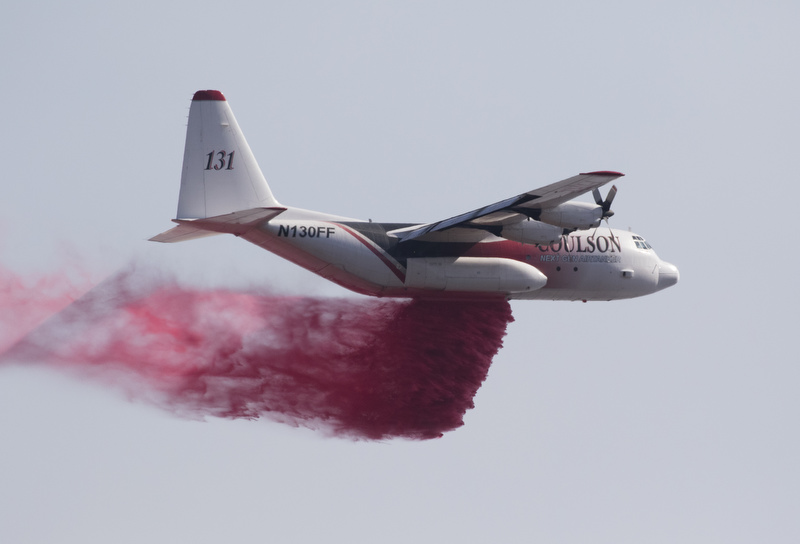 Staff Photo by Dan Henry / The Chattanooga Times Free Press- 11/9/16. A aircraft from the US Forestry Service drops fire retardant on a wildfire burning along the Flipper Bend area of Signal Mountain on November 9, 2016. According to a Hamilton County Government release this morning over 780 acres have burned on Flipper Bend and another 230 plus acres on nearby Mowbray Mountain.