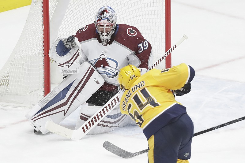 AP photo by Mark Humphrey / Colorado Avalanche goaltender Pavel Francouz blocks a shot by Nashville Predators center Mikael Granlund in the second period of Saturday's game in Nashville.