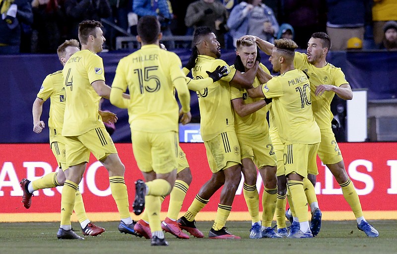 AP photo by Mark Zaleski / Nashville SC's Walker Zimmerman, third from right, celebrates his goal against Atlanta United FC during the first half of the Tennessee team's MLS debut on Feb. 29 at Nissan Stadium. Atlanta won 2-1.