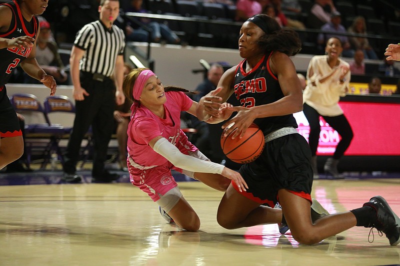 Tennessee Tech Photo / Former GPS and Hamilton Heights basketball player Akia Harris, in pink, has averaged 7.1 points and 4.8 assists this season as a senior at Tennessee Tech, with the assists average her best as a college player.