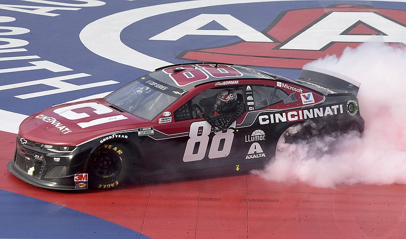 AP photo by Will Lester / NASCAR driver Alex Bowman celebrates with a burnout after winning the Cup Series race Sunday at Auto Club Speedway in Fontana, Calif.