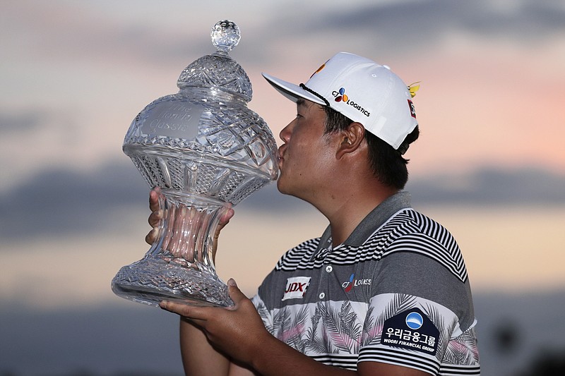 AP photo by Lynne Sladky / Sungjae Im kisses the trophy after winning the Honda Classic on Sunday in Palm Beach Gardens, Fla.