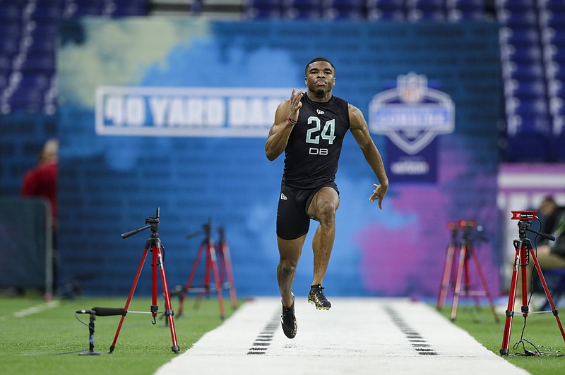 AP photo by Michael Conroy / Defensive back Jeff Okudah runs the 40-yard dash at the NFL's scouting combine Sunday in Indianapolis.