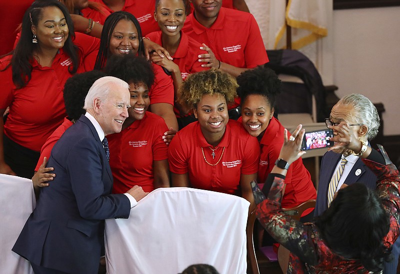 The choir takes a selfie with Democratic presidential candidate and former Vice President Joe Biden at Brown Chapel African Methodist Episcopal Church, Sunday, March 1, 2020, in Selma, Ala. (Curtis Compton/Atlanta Journal-Constitution via AP)