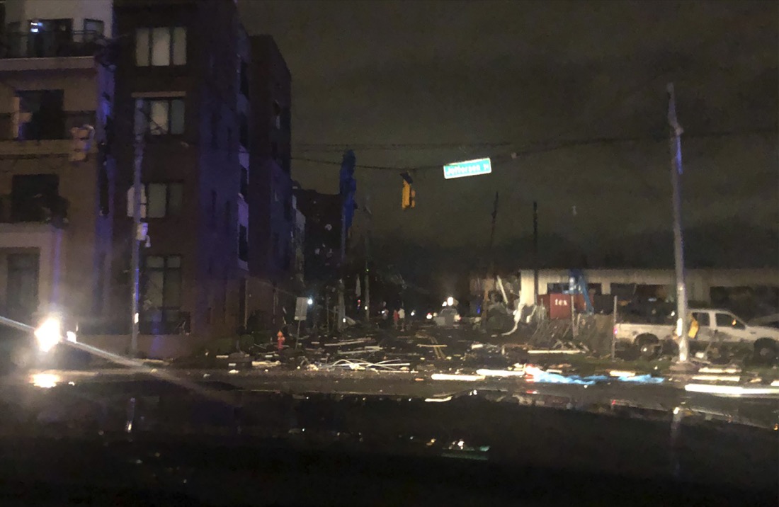 Debris scattered across an intersection Tuesday, March 3, 2020, in downtown Nashville, Tenn. The National Weather Service in Nashville confirmed a tornado touched down in the area. (Celia Darrough via AP)