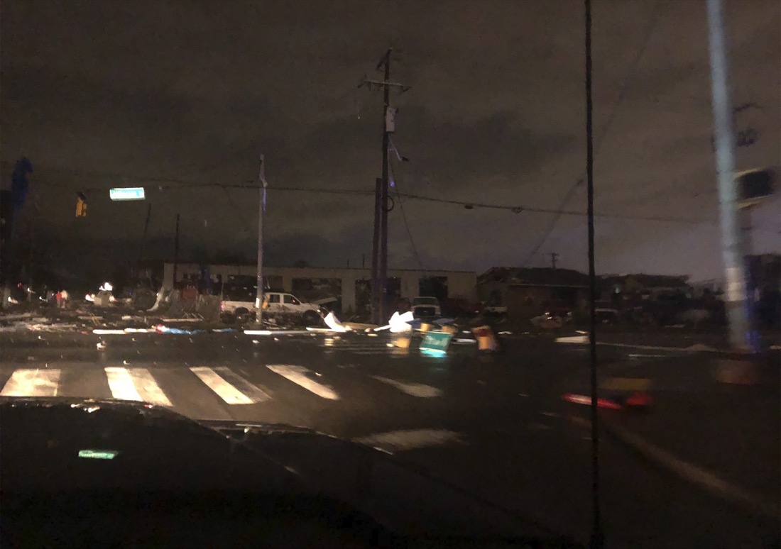 Debris scattered across an intersection Tuesday, March 3, 2020, in downtown Nashville, Tenn. The National Weather Service in Nashville confirmed a tornado touched down in the area. (Celia Darrough via AP)