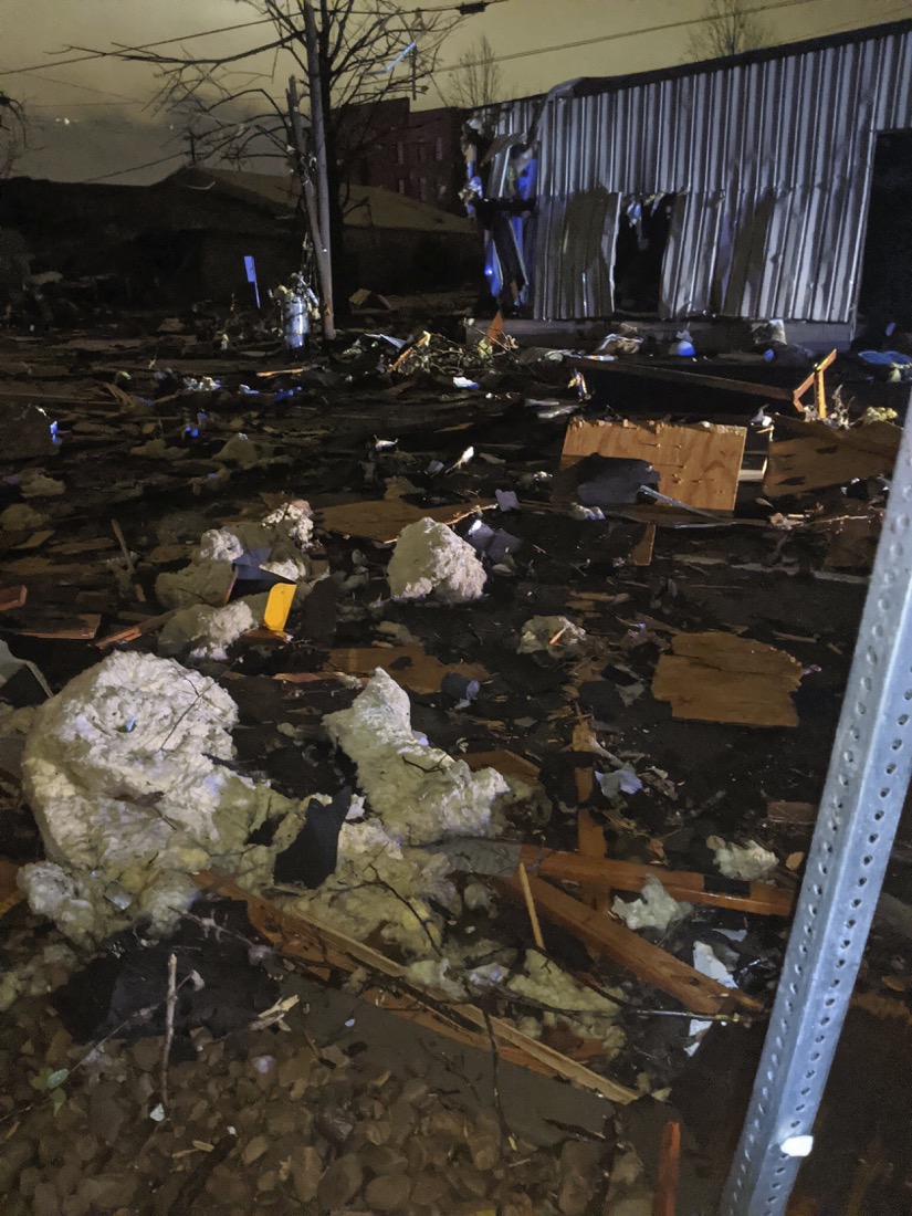 A lot is littered with debris brought on by a tornado that touched down in downtown Nashville, Tuesday, March 3, 2020. (Alex Carlson via AP)