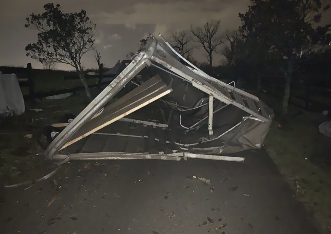 A damaged horse trailer lies toppled over at the Hidden Acres Farm after a tornado touched down in the area around Nashville, Tuesday, March 3, 2020. (Tara Shaver via AP)