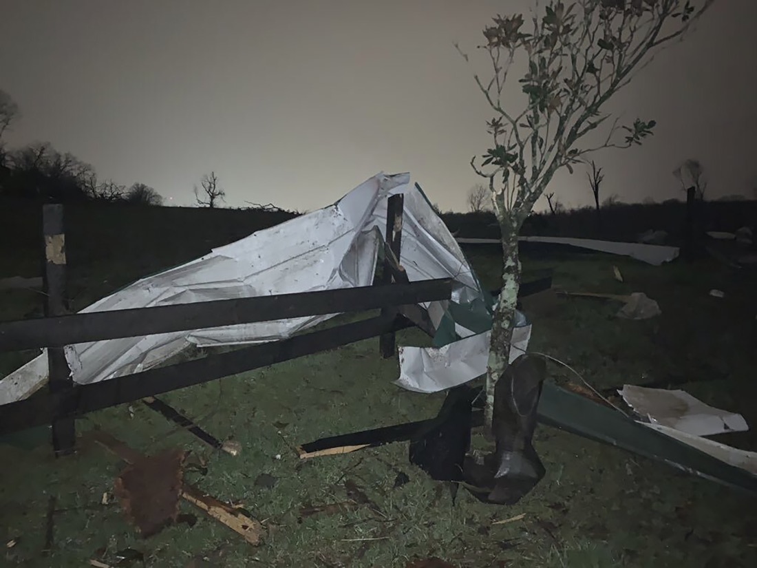A damaged fence lies with debris at the Hidden Acres Farm after a tornado touched down in the area around Nashville, Tuesday, March 3, 2020. (Tara Shaver via AP)
