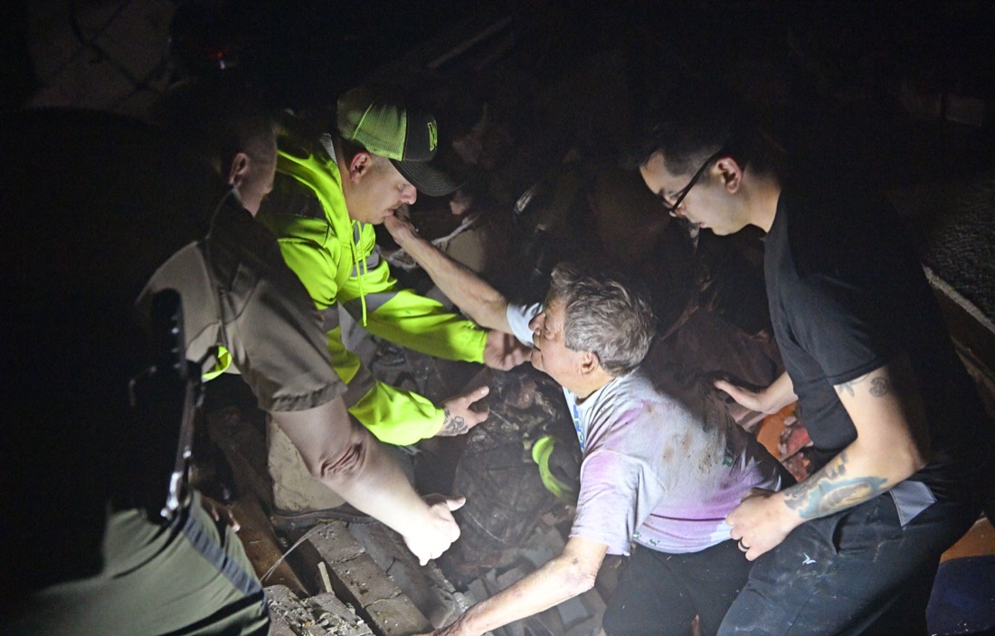 Bill Wallace reaches out to rescue workers who freed him from Barrett Dr home that collapsed on him and his wife Shirley trapping them under rubble. Shirley was taken for medical attention after a tornado ripped through neighborhoods in Mt. Juliet, Tenn. Tuesday, March 3, 2020.