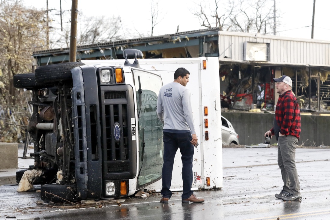 A overturned truck sits in a street in an area damaged by storms Tuesday, March 3, 2020, in Nashville, Tenn. Tornadoes ripped across Tennessee early Tuesday, shredding buildings and killing multiple people. (AP Photo/Mark Humphrey)