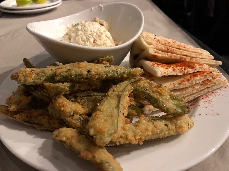 Photo by Susan Pierce / The pimento cheese appetizer at 1885 Grill Ooltewah isn't the orange, grated-Cheddar concoction mama made, but a creamy, white cheddar and cream cheese blend with minced pimento and jalapeno served with pita wedges and fried okra.