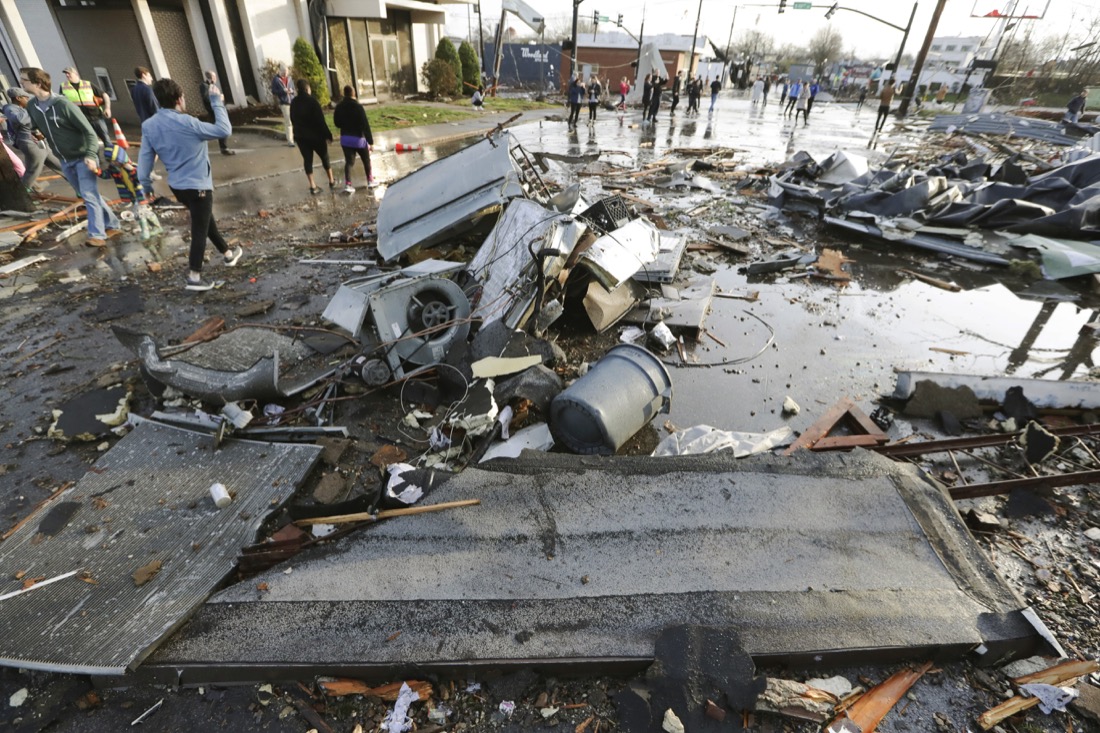 Debris covers a street after overnight storms Tuesday, March 3, 2020, in Nashville, Tenn. Tornadoes ripped across Tennessee early Tuesday, shredding buildings and killing multiple people. (AP Photo/Mark Humphrey)