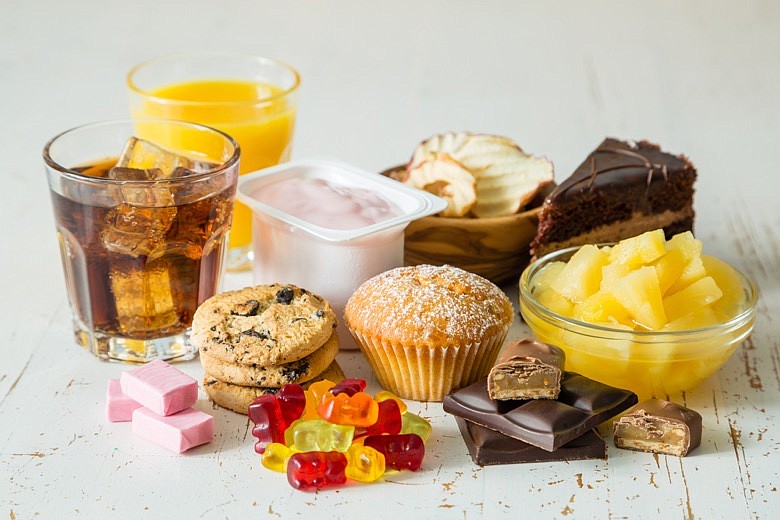 Selection of food high in sugar. / Getty Images/iStockphoto/a_namenko