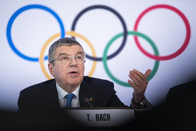 Keystone photo by Jean-Christophe Bott via AP / IOC president Thomas Bach speaks during a news conference after the organization's executive board met Wednesday at the Olympic headquarters in Lausanne, Switzerland.