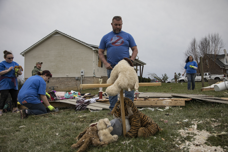 Staff photo by Troy Stolt / Mike Phillips stands in front of a memorial he made to honor his foster daughter Bridget McCormick, 13, after she was killed when a tornado destroyed the Phillips family's home early Tuesday morning in Cookeville, Tenn. on Wednesday, March 4, 2020. Phillips and his wife Kim were pinned down by a couch as the tornado caused the glass windows of the home to explode, and was unable to help his six children get to safety, his son found Bridget outside where the memorial was built.
