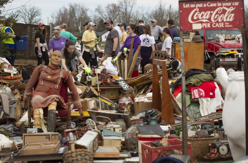 Staff photo by Troy Stolt / Volunteers bring undamaged belongings to the late Jessica Clark's front yard in Cookeville, Tenn on Wednesday, March 4, 2020. A tornado destroyed 140 buildings in Putnam County, killing at least 18 people, and leaving many without homes early Tuesday, Clark was one of those killed.